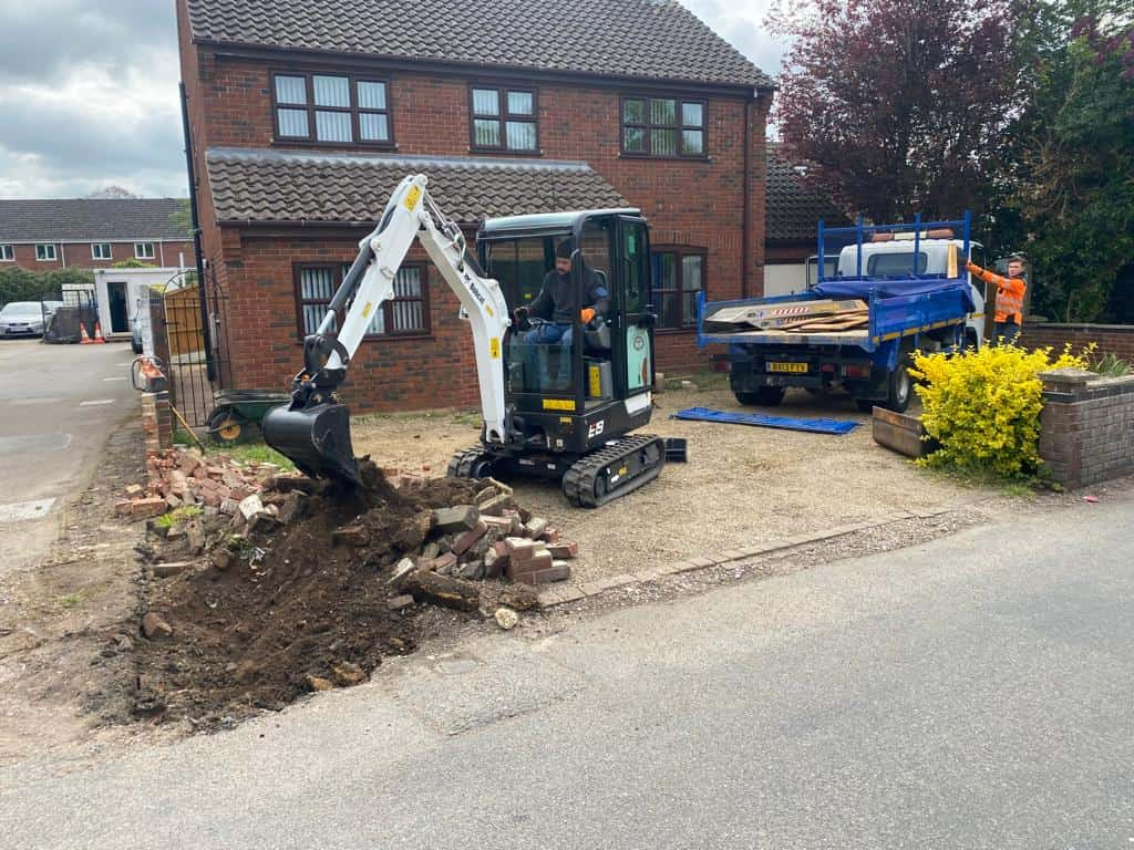 This is a photo of an operative of Eastbourne Driveways Digging out for a new tarmac driveway