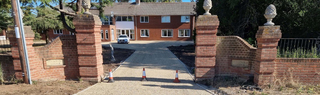 This is a photo of a newly installed chip and tar driveway, installed by Eastbourne Driveways